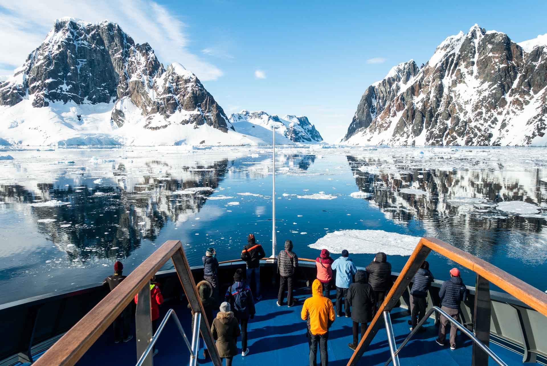 Travelers crossing Lemaire channel, in Antarctica, aboard Magellan Explorer. Photography by Sandra Walser.